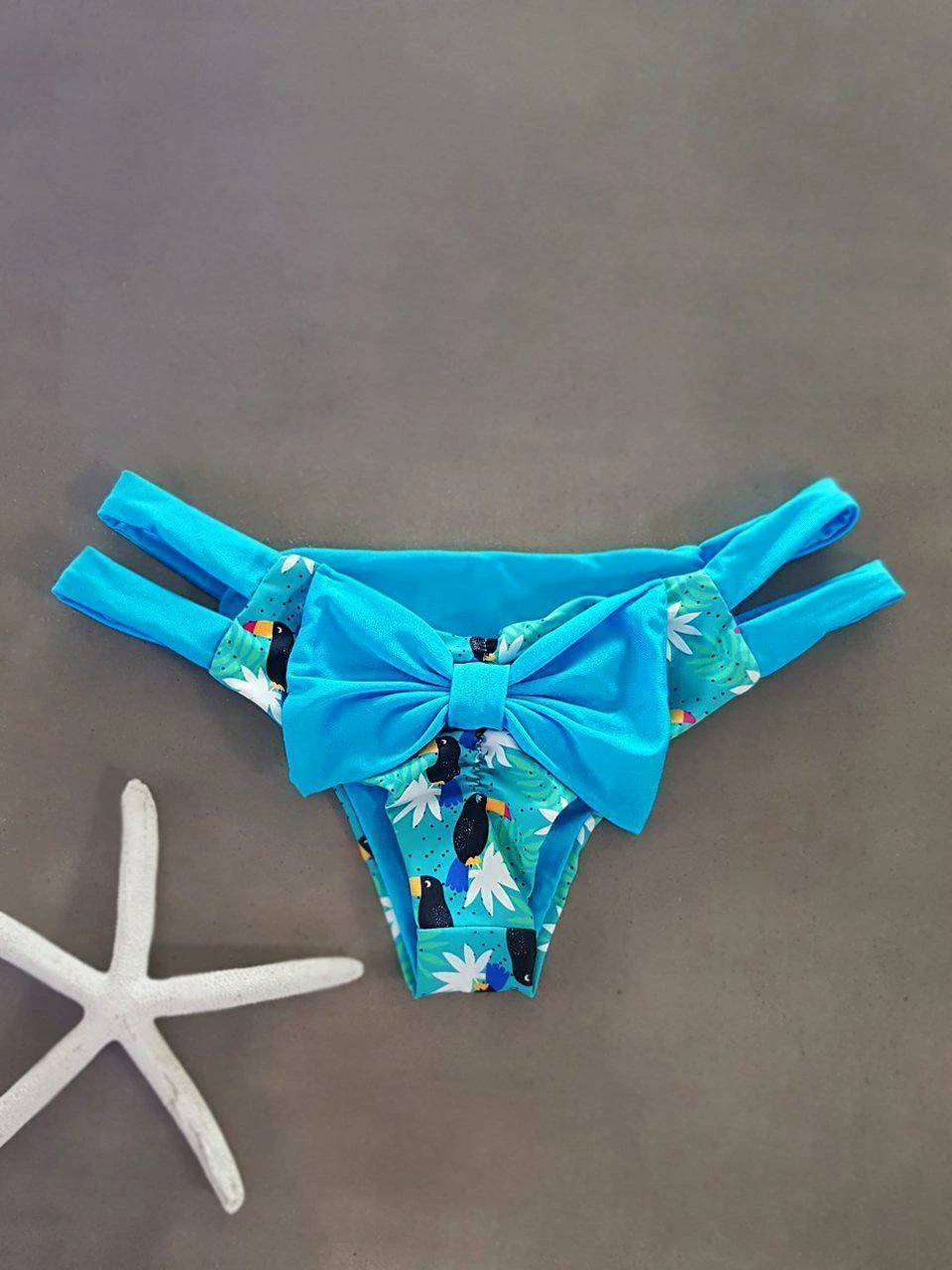Dollboxx Cheeky Bow Brazilian Bikini Bottom - Toucan Party / Blue 1 Dollboxx Cheeky Bow Brazilian Bikini Bottom - Toucan Party / Blue